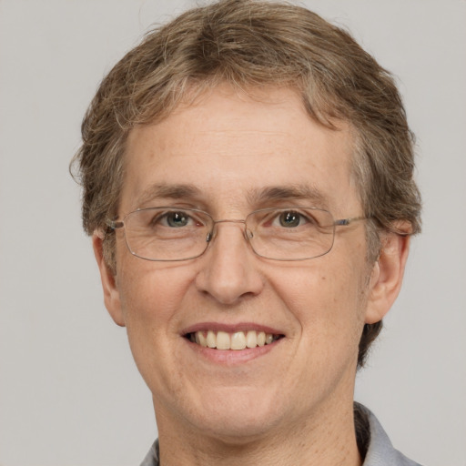 Joyful white middle-aged female with short  brown hair and grey eyes