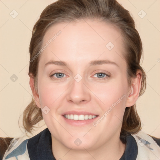 Joyful white young-adult female with medium  brown hair and blue eyes