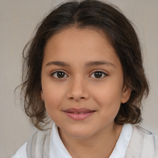 Joyful white child female with medium  brown hair and brown eyes