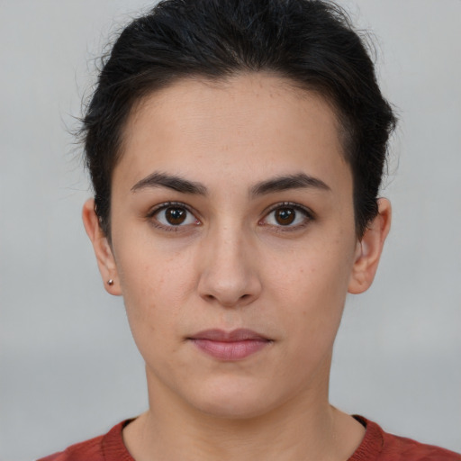 Neutral white young-adult female with short  brown hair and brown eyes