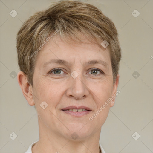 Joyful white adult female with short  brown hair and grey eyes