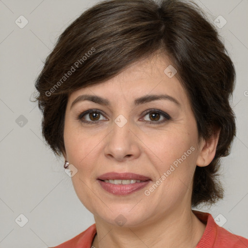 Joyful white adult female with medium  brown hair and brown eyes