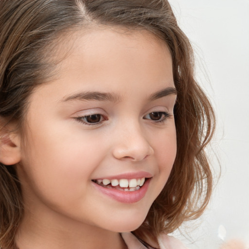 Joyful white child female with long  brown hair and brown eyes