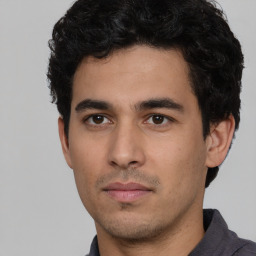 Neutral white young-adult male with short  black hair and brown eyes