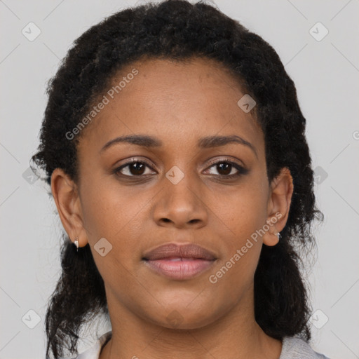 Joyful black young-adult female with medium  brown hair and brown eyes