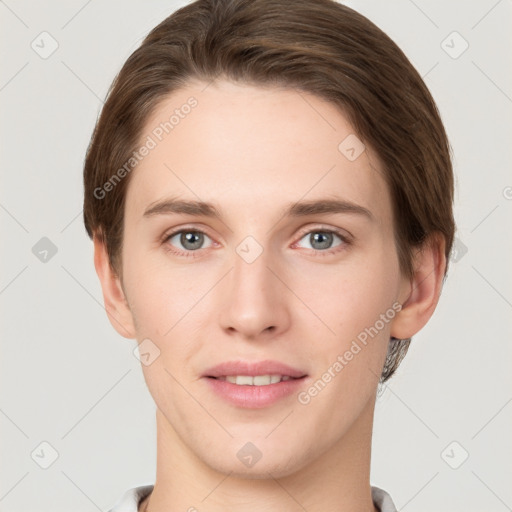 Joyful white young-adult female with short  brown hair and grey eyes