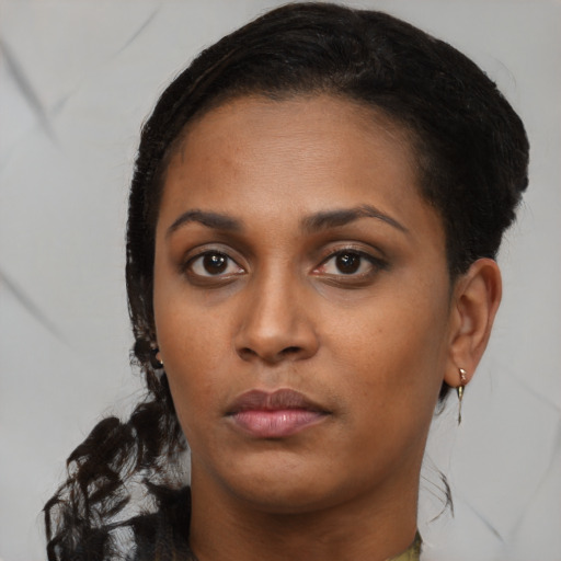 Neutral black young-adult female with long  brown hair and brown eyes