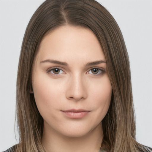 Neutral white young-adult female with long  brown hair and brown eyes