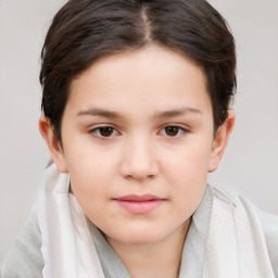 Joyful white child female with short  brown hair and brown eyes