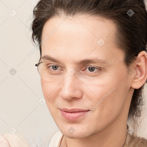 Joyful white young-adult male with medium  brown hair and brown eyes