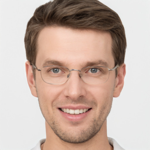 Joyful white adult male with short  brown hair and grey eyes