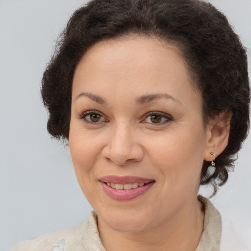 Joyful white adult female with medium  brown hair and brown eyes