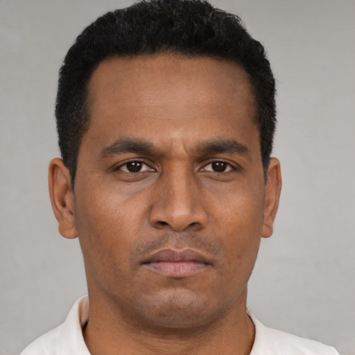 Neutral black young-adult male with short  black hair and brown eyes