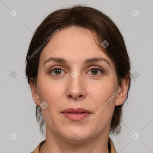 Joyful white adult female with medium  brown hair and grey eyes