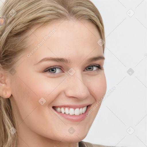 Joyful white young-adult female with long  brown hair and blue eyes