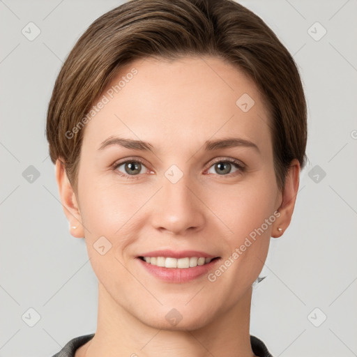 Joyful white young-adult female with short  brown hair and grey eyes