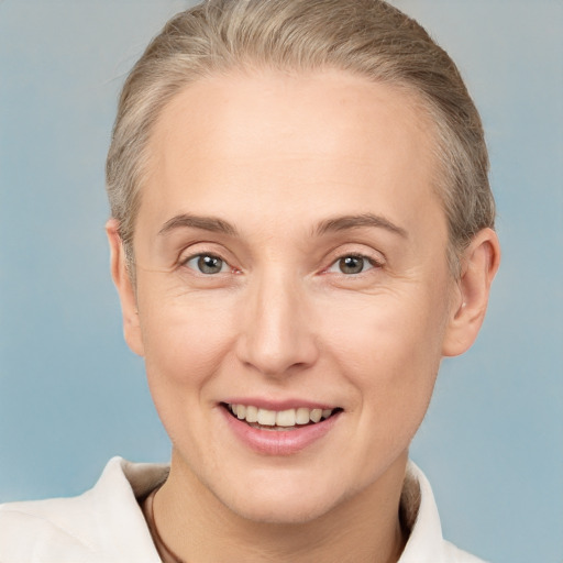 Joyful white adult female with short  brown hair and brown eyes