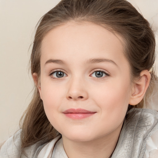 Joyful white child female with medium  brown hair and grey eyes