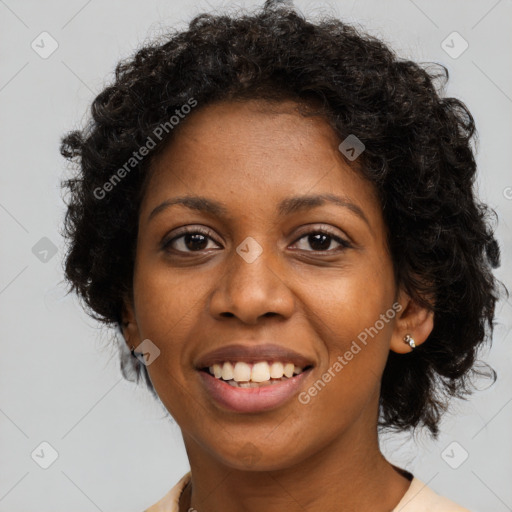 Joyful black young-adult female with long  brown hair and brown eyes