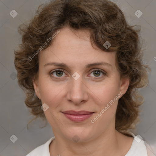 Joyful white young-adult female with medium  brown hair and green eyes