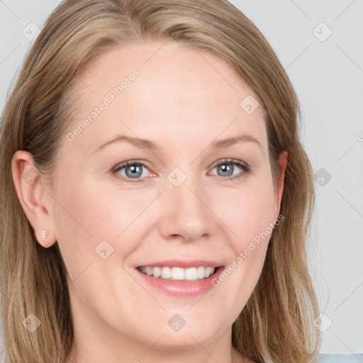 Joyful white young-adult female with long  brown hair and blue eyes