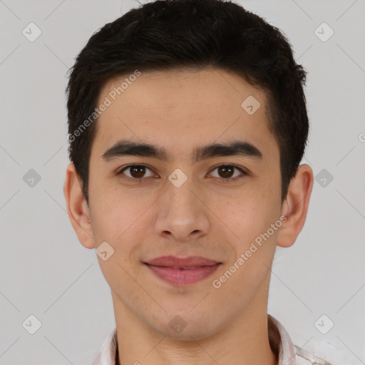 Joyful latino young-adult male with short  brown hair and brown eyes