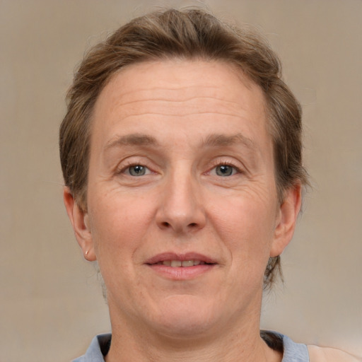 Joyful white adult male with medium  brown hair and grey eyes