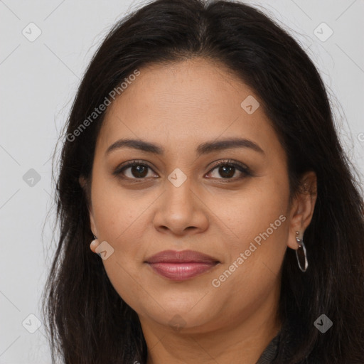 Joyful latino young-adult female with long  brown hair and brown eyes