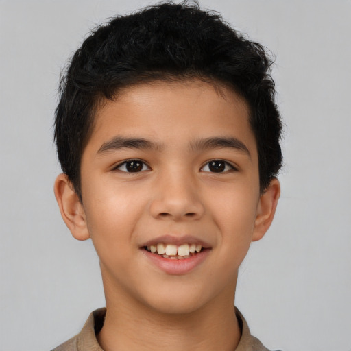 Joyful asian child male with short  brown hair and brown eyes
