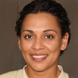 Joyful white adult female with short  brown hair and brown eyes