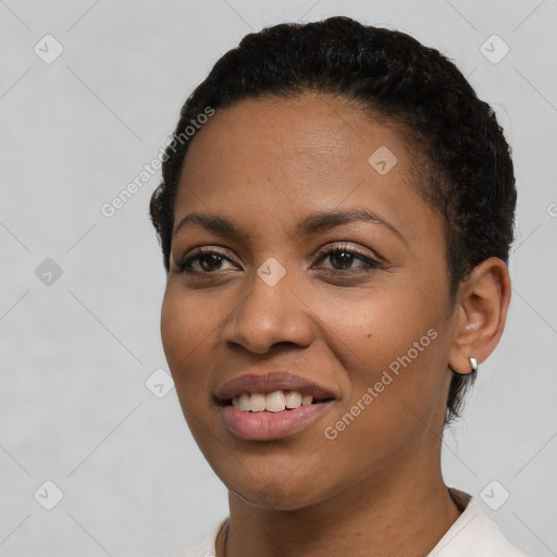 Joyful latino young-adult female with short  brown hair and brown eyes