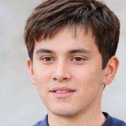 Joyful white child male with short  brown hair and brown eyes