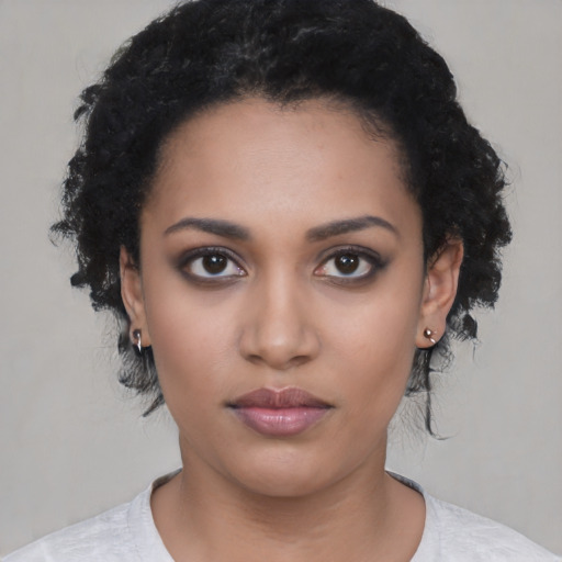 Neutral latino young-adult female with short  black hair and brown eyes