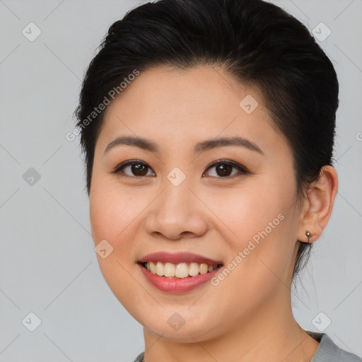 Joyful asian young-adult female with medium  brown hair and brown eyes