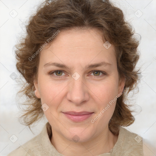 Joyful white adult female with medium  brown hair and green eyes