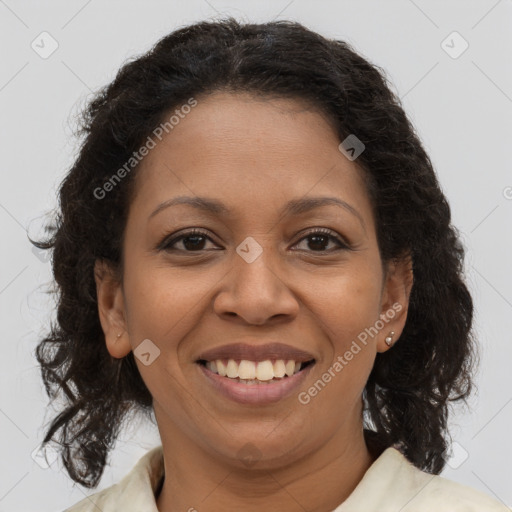 Joyful black young-adult female with medium  brown hair and brown eyes