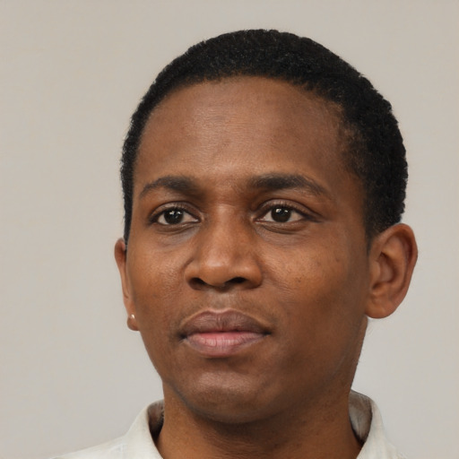 Neutral black adult male with short  black hair and brown eyes