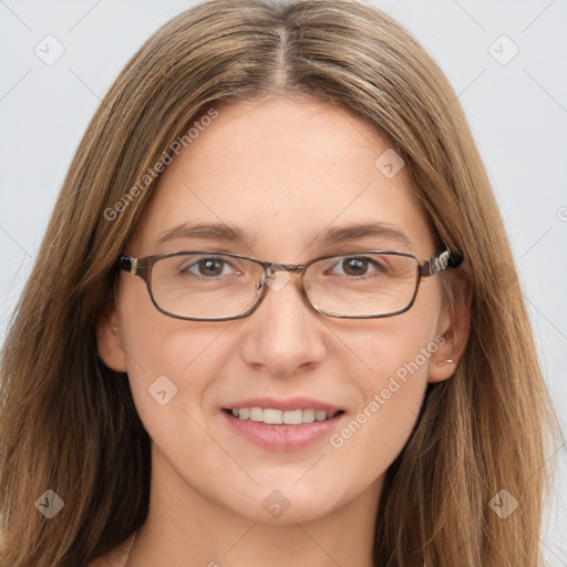 Joyful white adult female with long  brown hair and grey eyes