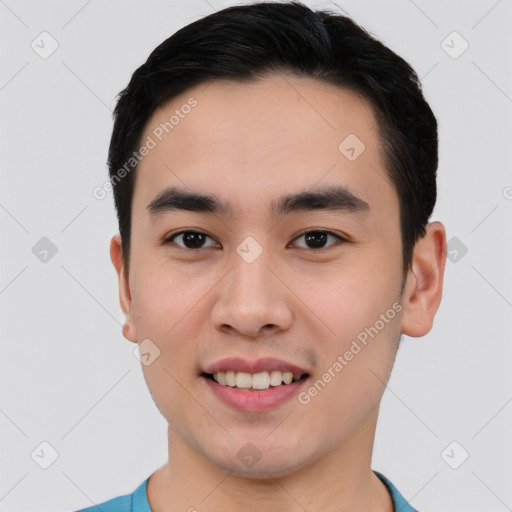 Joyful asian young-adult male with short  black hair and brown eyes