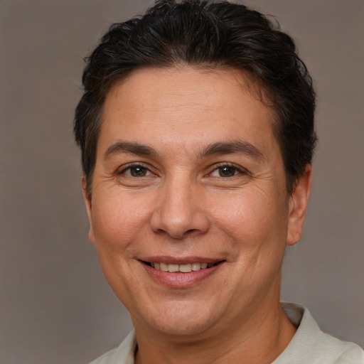 Joyful white adult female with short  brown hair and brown eyes