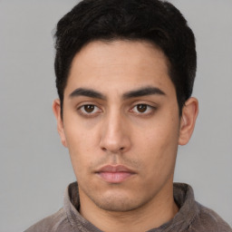 Neutral latino young-adult male with short  black hair and brown eyes