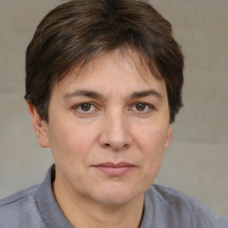 Joyful white adult female with short  brown hair and brown eyes