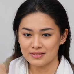 Joyful asian young-adult female with medium  brown hair and brown eyes