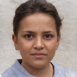 Joyful white child female with short  brown hair and brown eyes