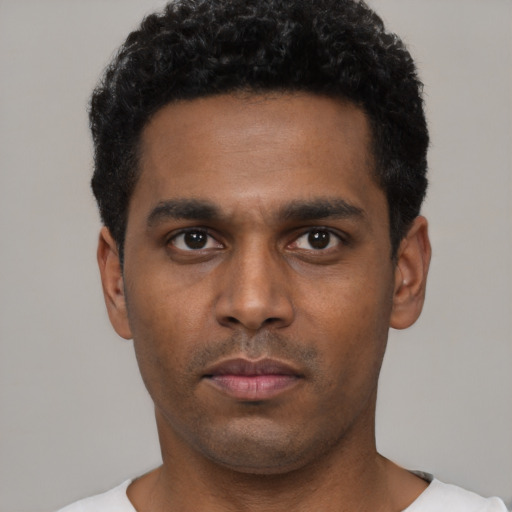 Neutral black young-adult male with short  black hair and brown eyes