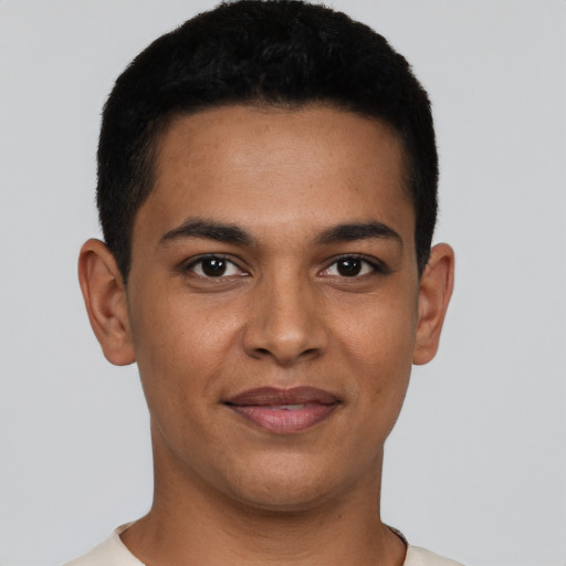 Joyful latino young-adult male with short  brown hair and brown eyes