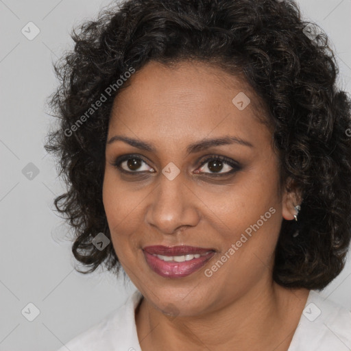 Joyful black young-adult female with medium  brown hair and brown eyes