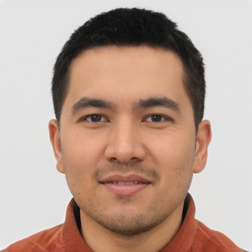 Joyful asian young-adult male with short  black hair and brown eyes