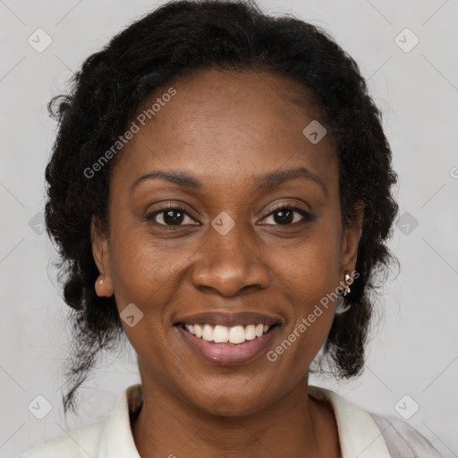 Joyful black young-adult female with medium  black hair and brown eyes