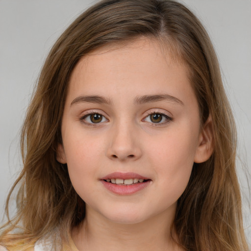 Joyful white child female with long  brown hair and brown eyes